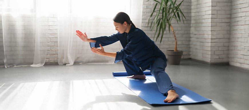 Woman practicing karate pose